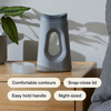 Gray Loona on a wooden nightstand with feature labels: comfortable contours, snap-close lid, easy hold handle, and night-sized