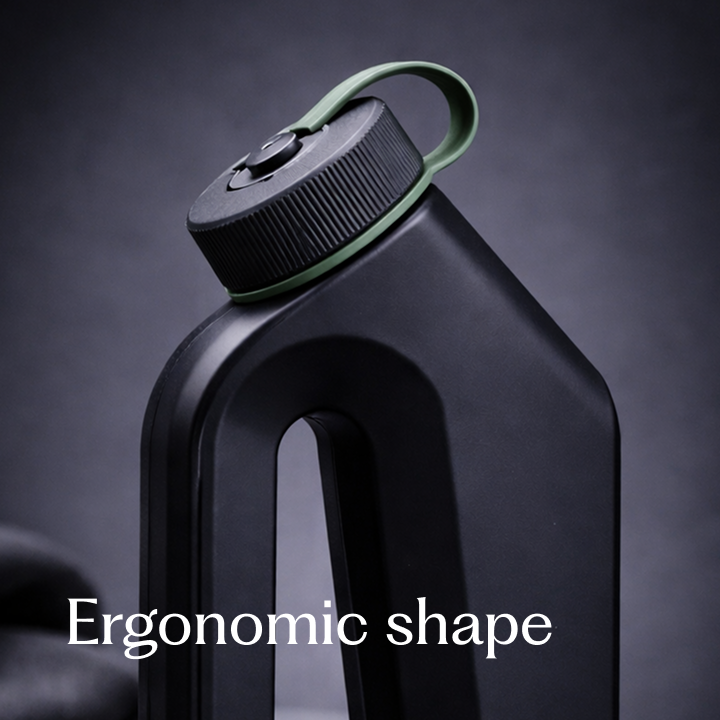 Close-up of black Tanker male urinal highlighting its ergonomic shape and ribbed twist-lock cap with green carry loop